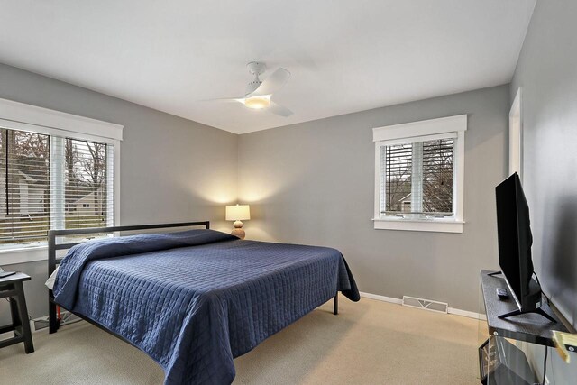 831 Sauganash Dr, Fontana, WI 53125 - bedroom featuring baseboards, visible vents, carpet, and a ceiling fan