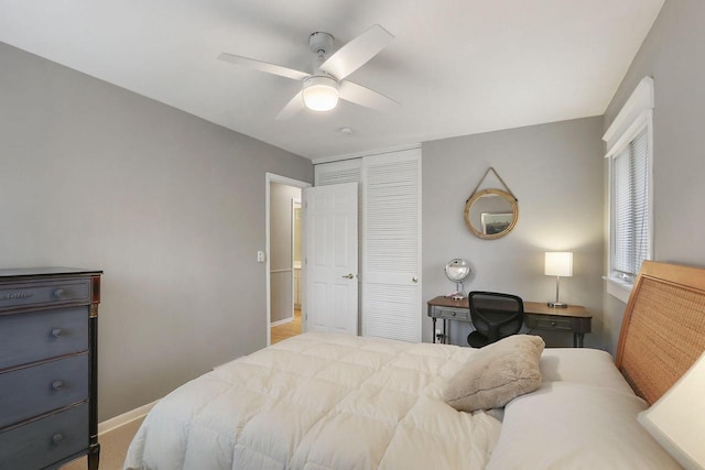 831 Sauganash Dr, Fontana, WI 53125 - bedroom with baseboards, a closet, and a ceiling fan