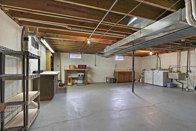 831 Sauganash Dr, Fontana, WI 53125 - basement featuring a sink and washer and clothes dryer