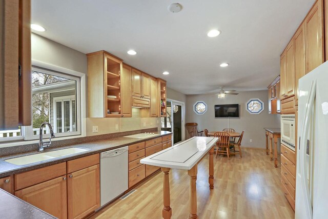 831 Sauganash Dr, Fontana, WI 53125 - kitchen with light wood finished floors, white appliances, recessed lighting, a ceiling fan, and a sink