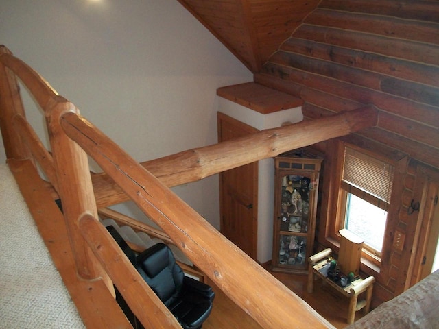 stairway featuring vaulted ceiling