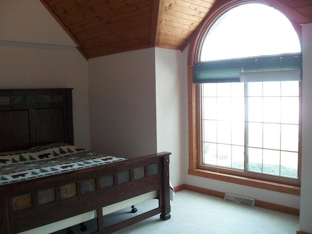carpeted bedroom featuring wooden ceiling, baseboards, lofted ceiling, and visible vents