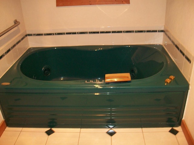 full bathroom featuring a jetted tub and tile patterned floors