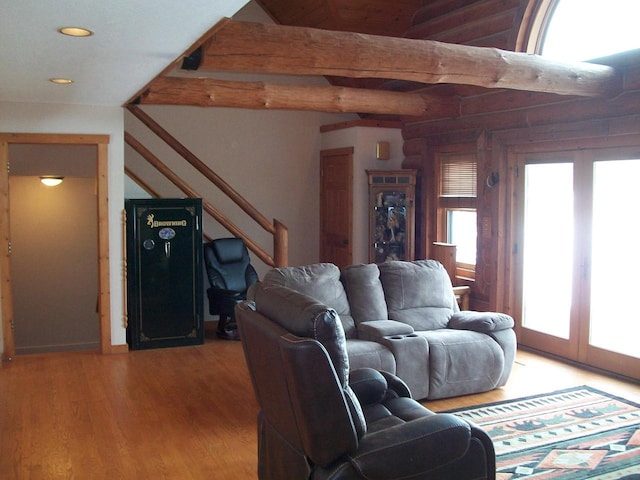 living area with stairs, french doors, light wood-type flooring, beamed ceiling, and recessed lighting