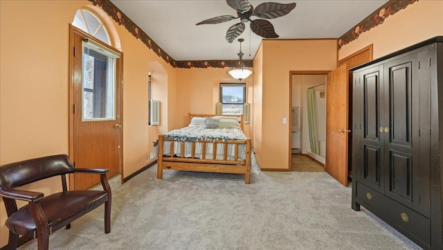 712 Water St, Genoa, WI 54632 - carpeted bedroom featuring baseboards and a ceiling fan