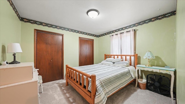 712 Water St, Genoa, WI 54632 - bedroom with light carpet and multiple closets