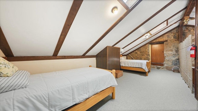 712 Water St, Genoa, WI 54632 - carpeted bedroom with lofted ceiling with beams