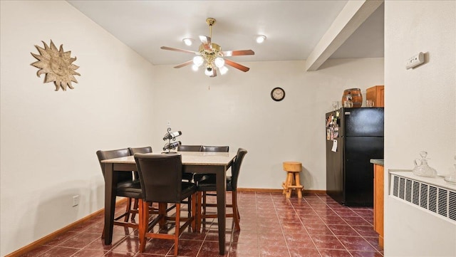 712 Water St, Genoa, WI 54632 - dining area with baseboards, ceiling fan, and dark tile patterned floors