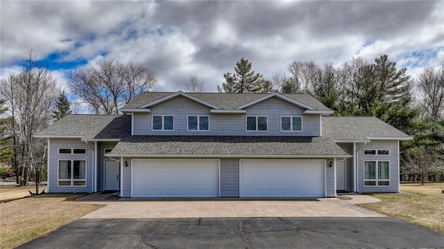 27183 250th St, Holcombe, WI 54745 - view of front of home with driveway, a garage, roof with shingles, and a front yard