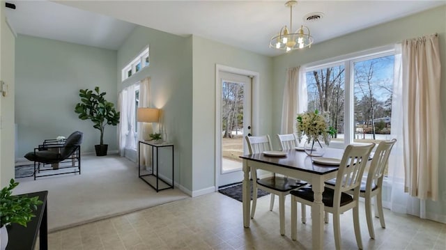 27183 250th St, Holcombe, WI 54745 - dining space featuring an inviting chandelier, baseboards, light colored carpet, and visible vents