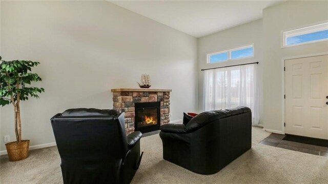 27183 250th St, Holcombe, WI 54745 - carpeted living area featuring baseboards, a fireplace, and a high ceiling