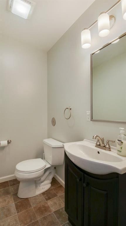 27183 250th St, Holcombe, WI 54745 - bathroom with toilet, vanity, and baseboards