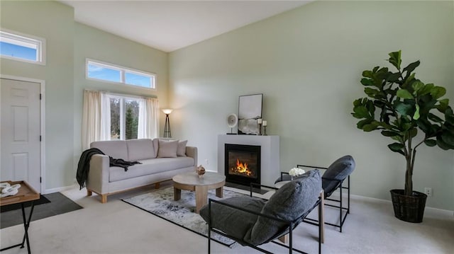 27183 250th St, Holcombe, WI 54745 - living area with baseboards, a glass covered fireplace, and carpet