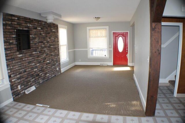2159 Clarence Ave, Racine, WI 53405 - foyer entrance with baseboards, visible vents, carpet floors, and tile patterned floors