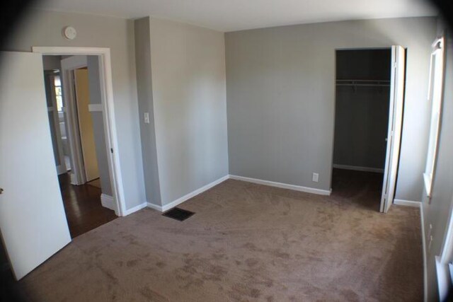 2159 Clarence Ave, Racine, WI 53405 - unfurnished bedroom featuring baseboards, a closet, and carpet floors