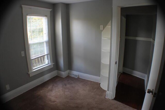 2159 Clarence Ave, Racine, WI 53405 - unfurnished bedroom featuring baseboards and carpet floors