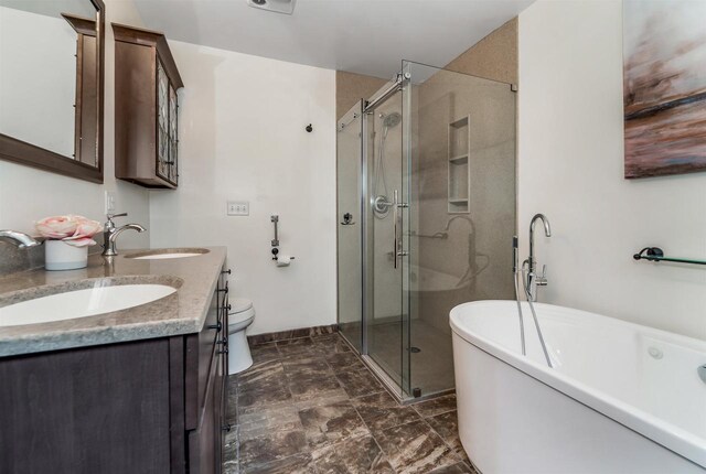 2015 Hickory Ln, Oshkosh, WI 54901 - bathroom featuring a shower stall, a soaking tub, double vanity, and a sink