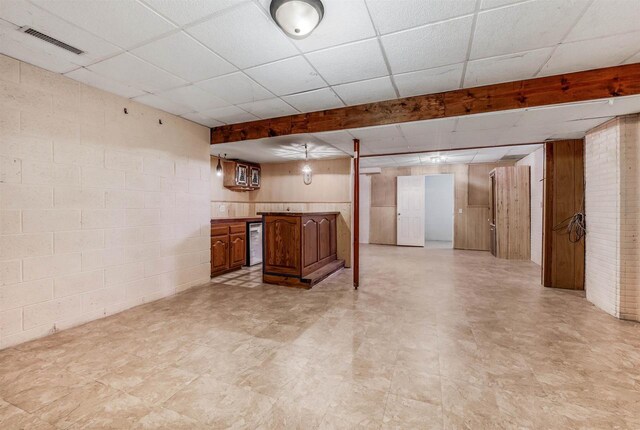 2015 Hickory Ln, Oshkosh, WI 54901 - finished below grade area featuring visible vents, a paneled ceiling, wine cooler, concrete block wall, and light floors
