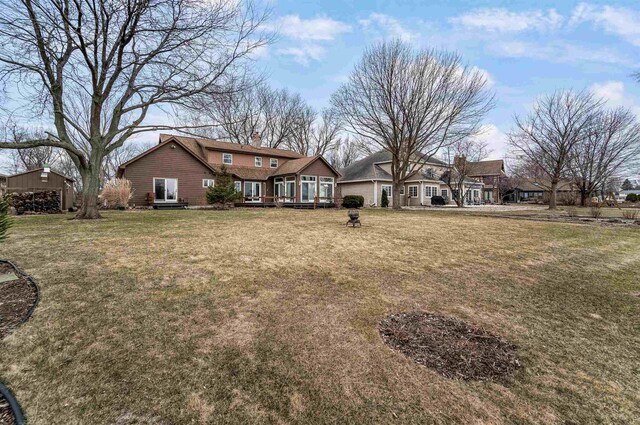 2015 Hickory Ln, Oshkosh, WI 54901 - rear view of property featuring a chimney and a yard
