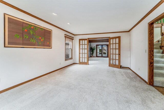 2015 Hickory Ln, Oshkosh, WI 54901 - carpeted spare room with stairway, french doors, baseboards, and ornamental molding