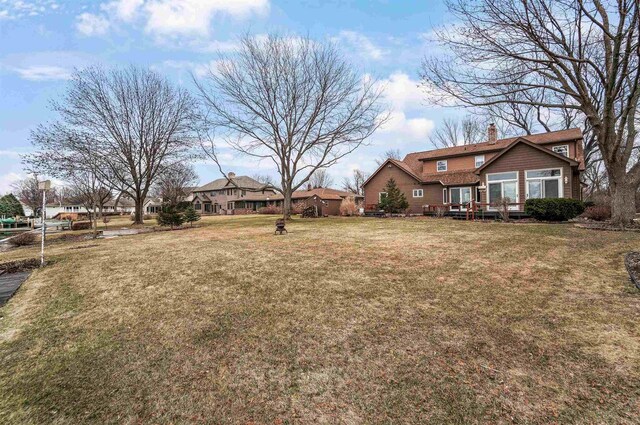 2015 Hickory Ln, Oshkosh, WI 54901 - view of yard featuring a deck