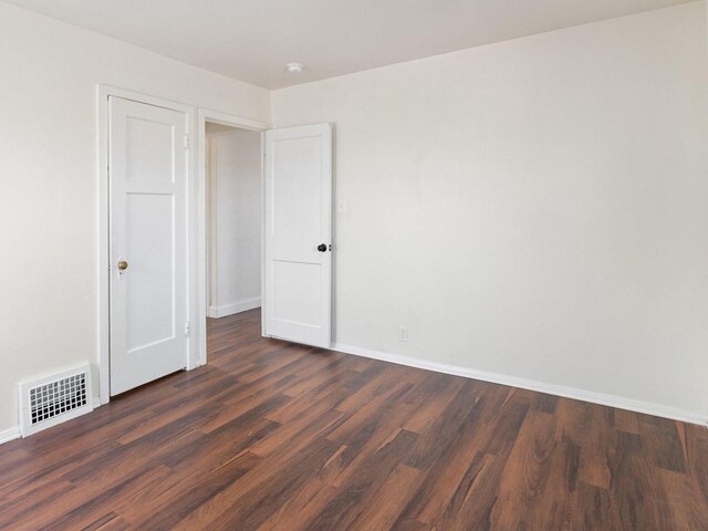 4348 N 30th St, Milwaukee, WI 53216 - empty room featuring baseboards, visible vents, and wood finished floors