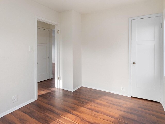 4348 N 30th St, Milwaukee, WI 53216 - spare room featuring baseboards and wood finished floors
