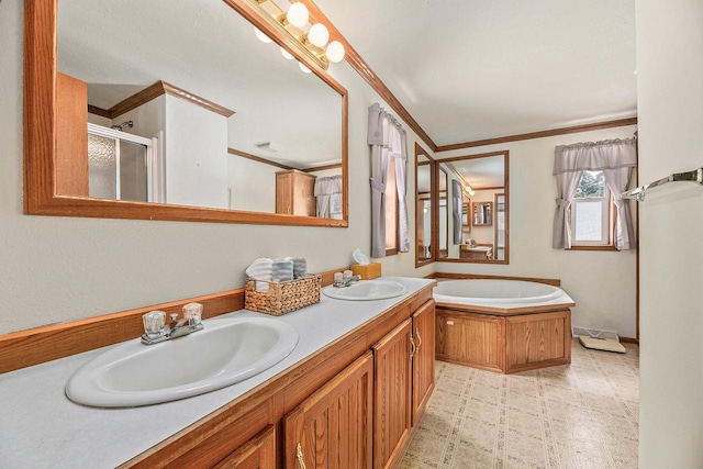 843 Sundstein Rd, Eagle River, WI 54521 - bathroom with crown molding, a stall shower, double vanity, a garden tub, and tile patterned floors