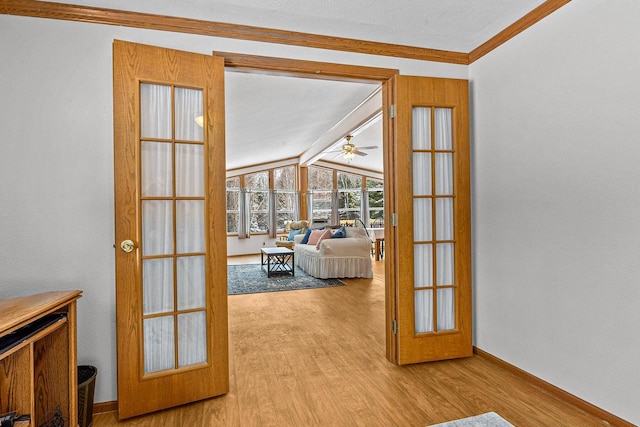 843 Sundstein Rd, Eagle River, WI 54521 - doorway with wood finished floors, vaulted ceiling, ceiling fan, french doors, and ornamental molding