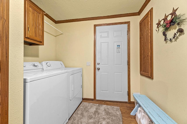 843 Sundstein Rd, Eagle River, WI 54521 - laundry area featuring independent washer and dryer, cabinet space, light wood finished floors, crown molding, and a textured ceiling