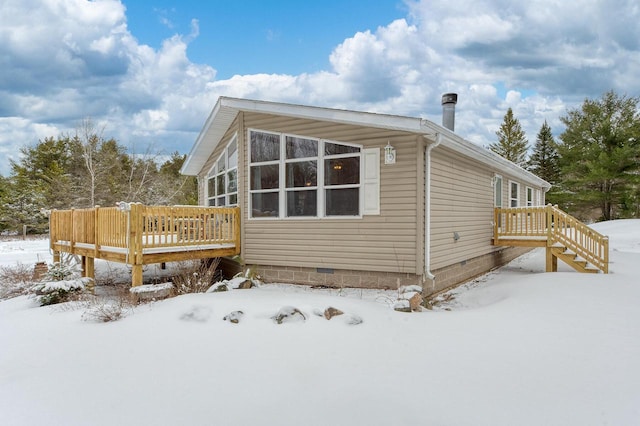 843 Sundstein Rd, Eagle River, WI 54521 - view of snow covered exterior with a deck and crawl space