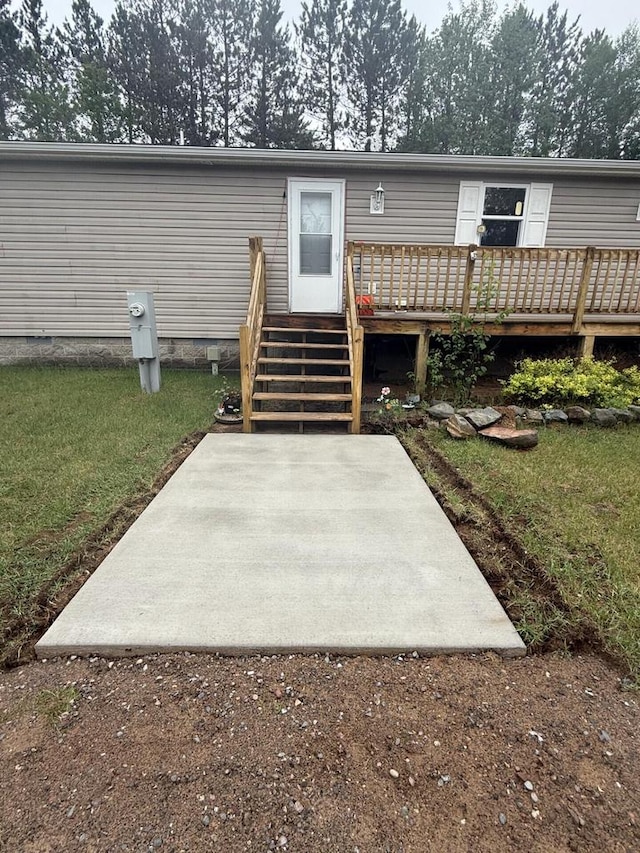 843 Sundstein Rd, Eagle River, WI 54521 - rear view of property with a patio area and a wooden deck