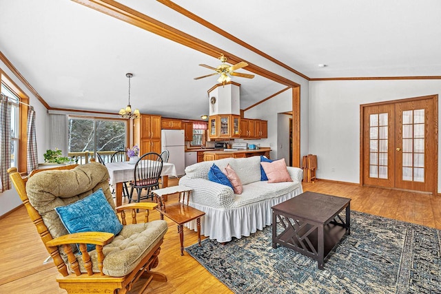 843 Sundstein Rd, Eagle River, WI 54521 - living area with crown molding, a chandelier, light wood-style floors, a ceiling fan, and baseboards
