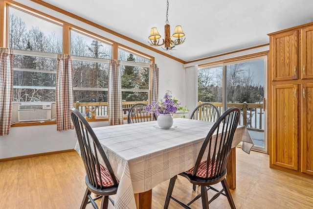 843 Sundstein Rd, Eagle River, WI 54521 - dining space with a chandelier, light wood-style floors, ornamental molding, and baseboards