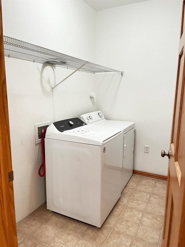 200 Femrite Dr Unit 211, Monona, WI 53716 - washroom with washing machine and clothes dryer and light tile patterned floors