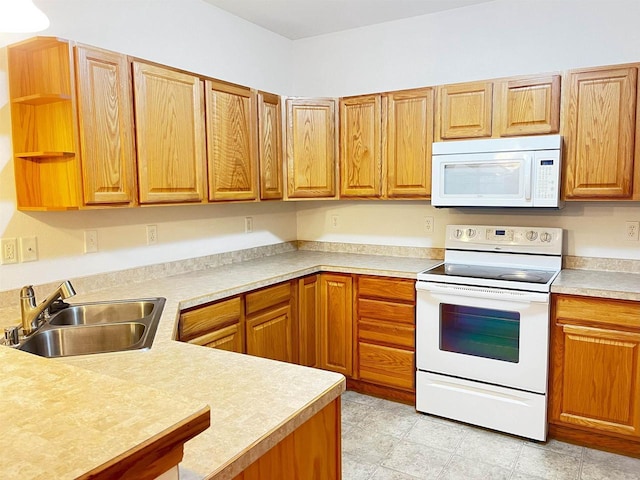 200 Femrite Dr Unit 211, Monona, WI 53716 - kitchen with white appliances, a sink, light countertops, open shelves, and a peninsula