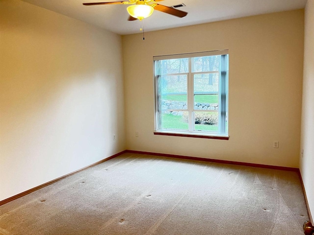200 Femrite Dr Unit 211, Monona, WI 53716 - spare room with light colored carpet, ceiling fan, and baseboards