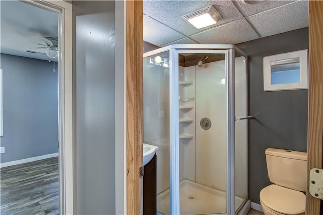 W1797 County Road A, Mindoro, WI 54644 - bathroom with toilet, visible vents, a shower stall, and wood finished floors