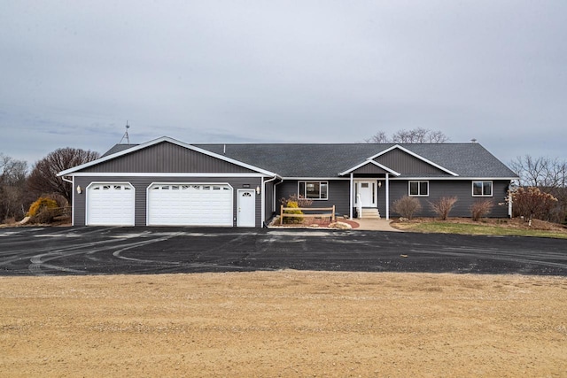 34506 Pleasant Point Dr, Winona, MN 55987 - ranch-style house featuring a garage, asphalt driveway, and a shingled roof
