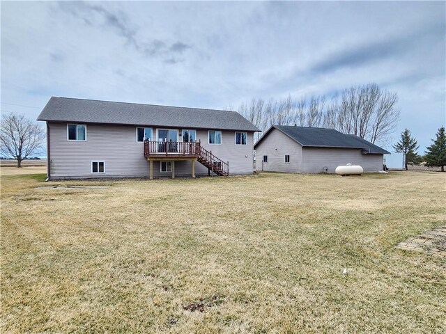 W9620 Hixwood Rd, Thorp, WI 54771 - rear view of property featuring a yard, a wooden deck, and stairs