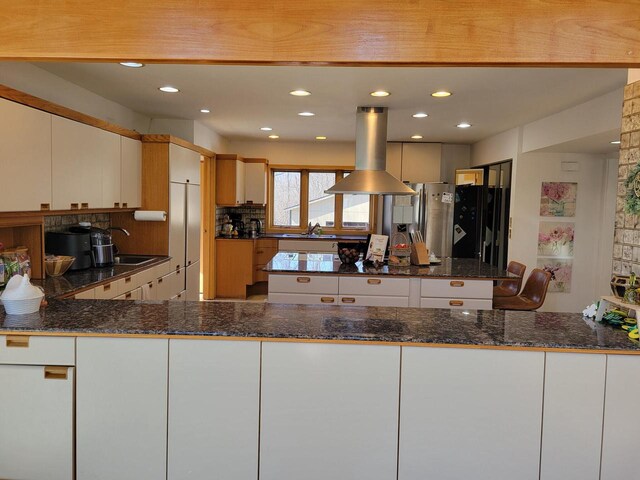 8100 160th Ave, Bristol, WI 53104 - kitchen with island exhaust hood, a peninsula, a sink, and freestanding refrigerator