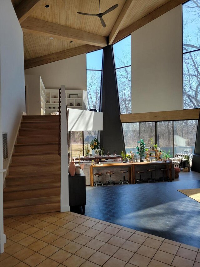 8100 160th Ave, Bristol, WI 53104 - interior space with a ceiling fan, a wealth of natural light, beam ceiling, and a wall of windows