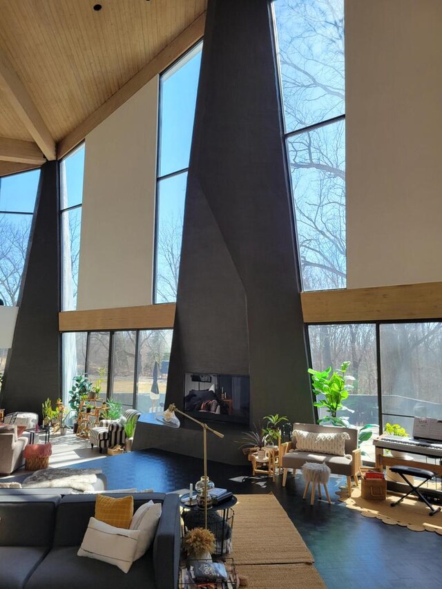 8100 160th Ave, Bristol, WI 53104 - living room with a wall of windows, a high ceiling, and wood ceiling