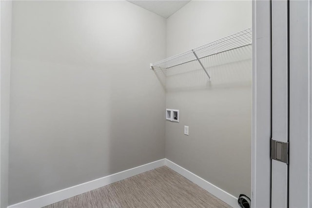 721 Jacko Ct, Hudson, WI 54016 - washroom featuring baseboards, washer hookup, wood finished floors, and laundry area