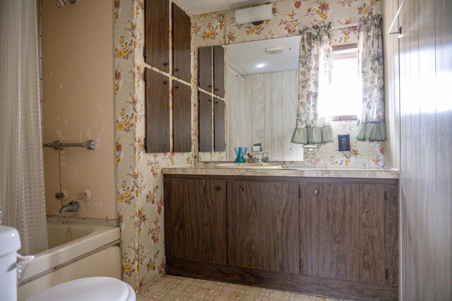 N7363 Wahneeta Ave, New Lisbon, WI 53950 - full bathroom with shower / bath combination with curtain, wallpapered walls, toilet, and vanity