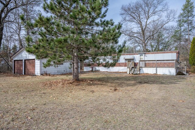 N7363 Wahneeta Ave, New Lisbon, WI 53950 - view of yard featuring a garage