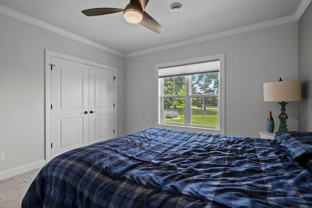 6612 Florance Ruth Ln, Sun Prairie, WI 53590 - carpeted bedroom with ornamental molding, a closet, baseboards, and a ceiling fan