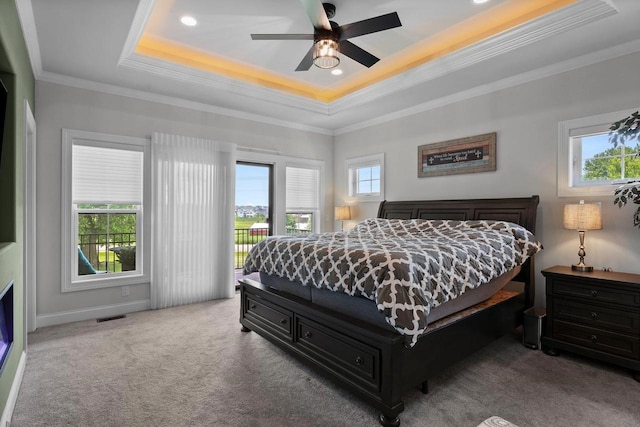 6612 Florance Ruth Ln, Sun Prairie, WI 53590 - carpeted bedroom with a tray ceiling, access to outside, ornamental molding, recessed lighting, and a ceiling fan
