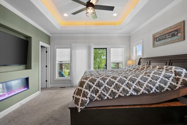 6612 Florance Ruth Ln, Sun Prairie, WI 53590 - carpeted bedroom featuring a tray ceiling, ornamental molding, baseboards, a ceiling fan, and recessed lighting