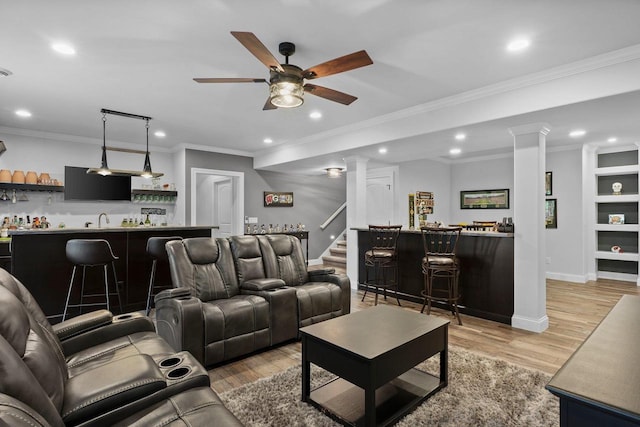 6612 Florance Ruth Ln, Sun Prairie, WI 53590 - living room featuring decorative columns, wet bar, ceiling fan, recessed lighting, and light wood-type flooring